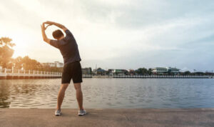 Young athletes stretching at the park.